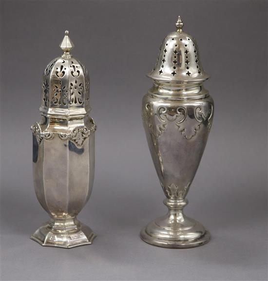 Two early 20th century silver sugar casters (loaded), tallest 18.5cm.